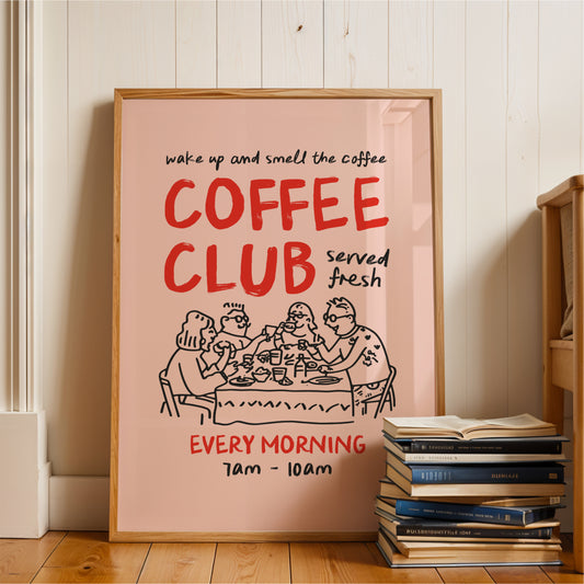 a poster advertising a coffee club, with a group of people sitting around a table enjoying coffee. The poster has a pink background and red text, and it is placed next to a stack of books.