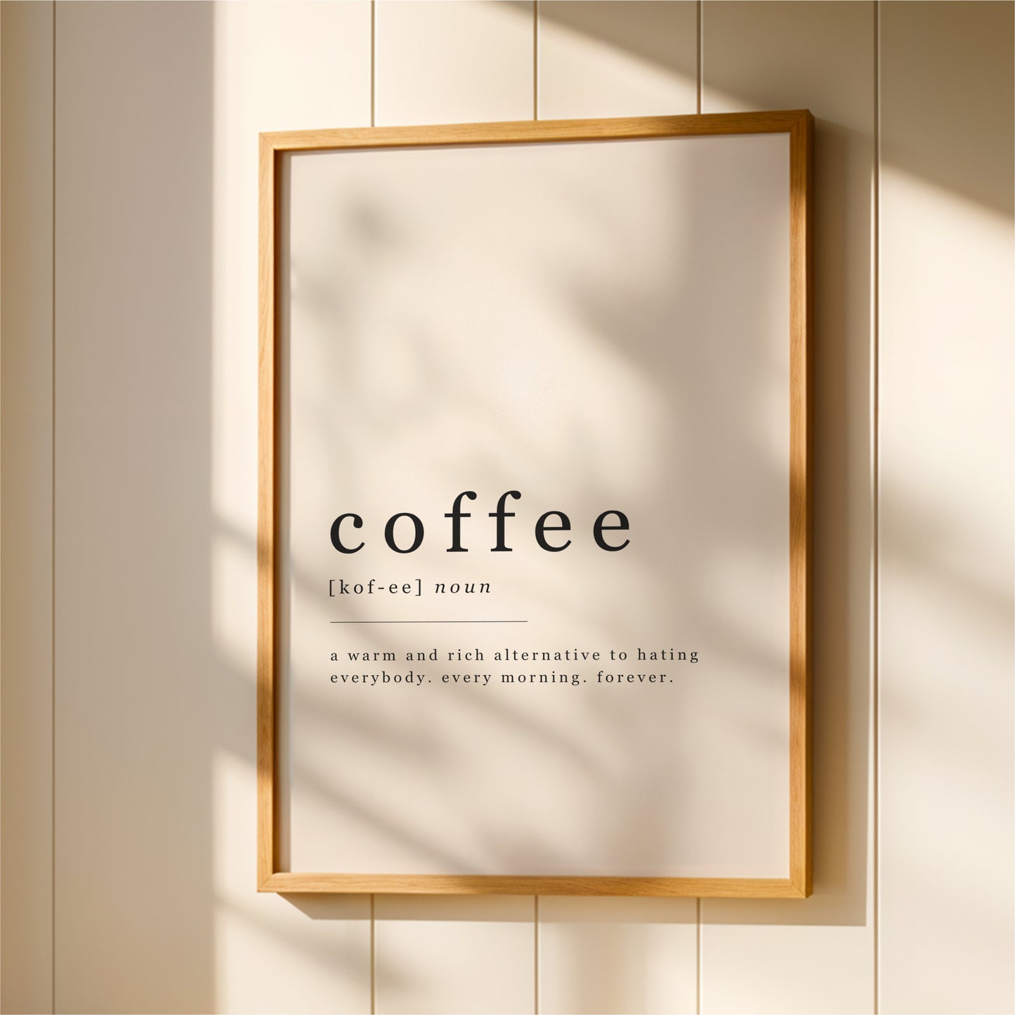 A framed definition of coffee hanging on a wall.
