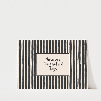 A black and white striped card with a message written on it.