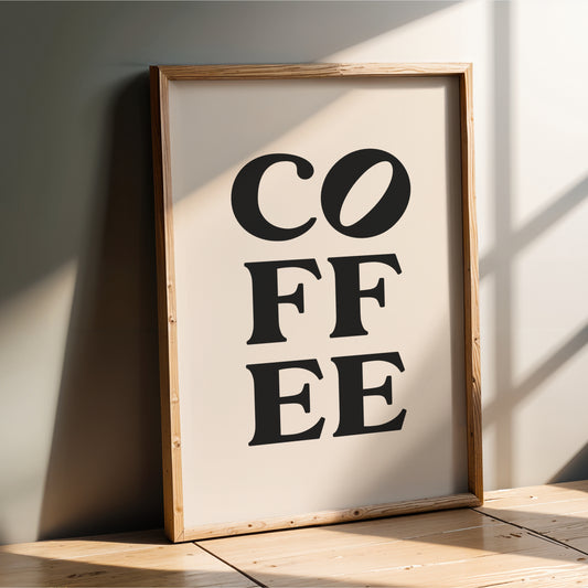 A framed poster with the text "COFFEE" prominently displayed in the center.