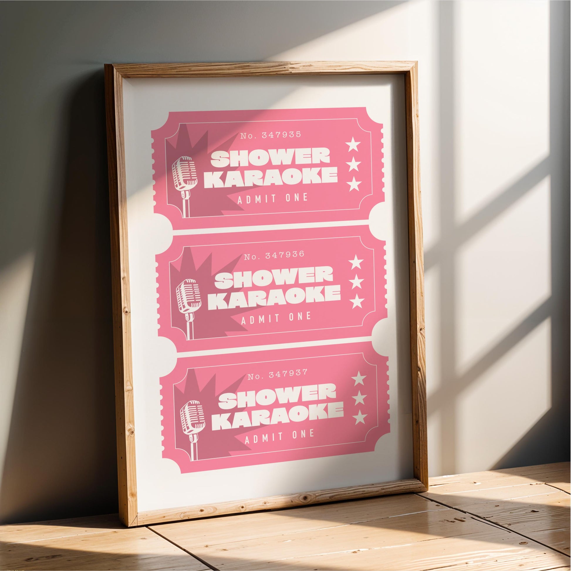 A framed poster advertising shower karaoke events, with three tickets displayed in a pink color.
