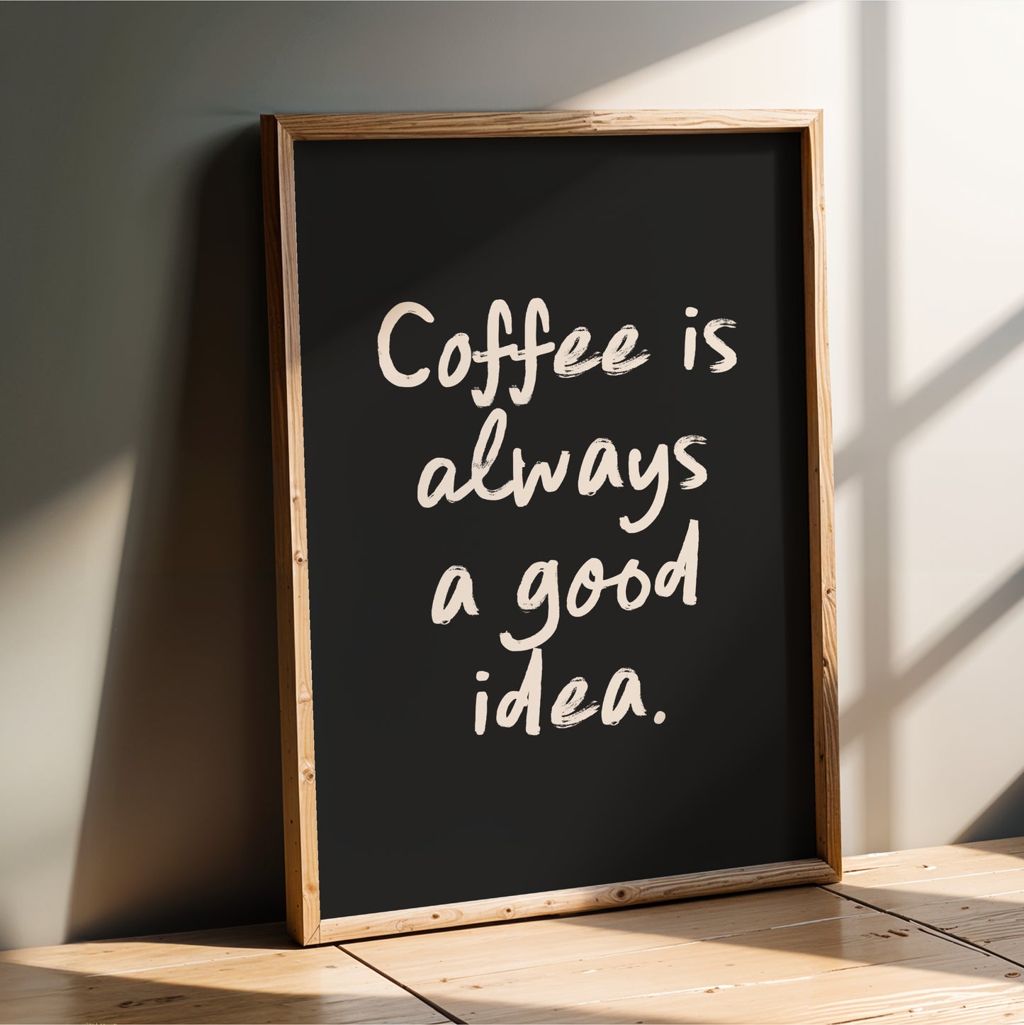 A blackboard with the text "Coffee is always a good idea" written on it in white chalk.