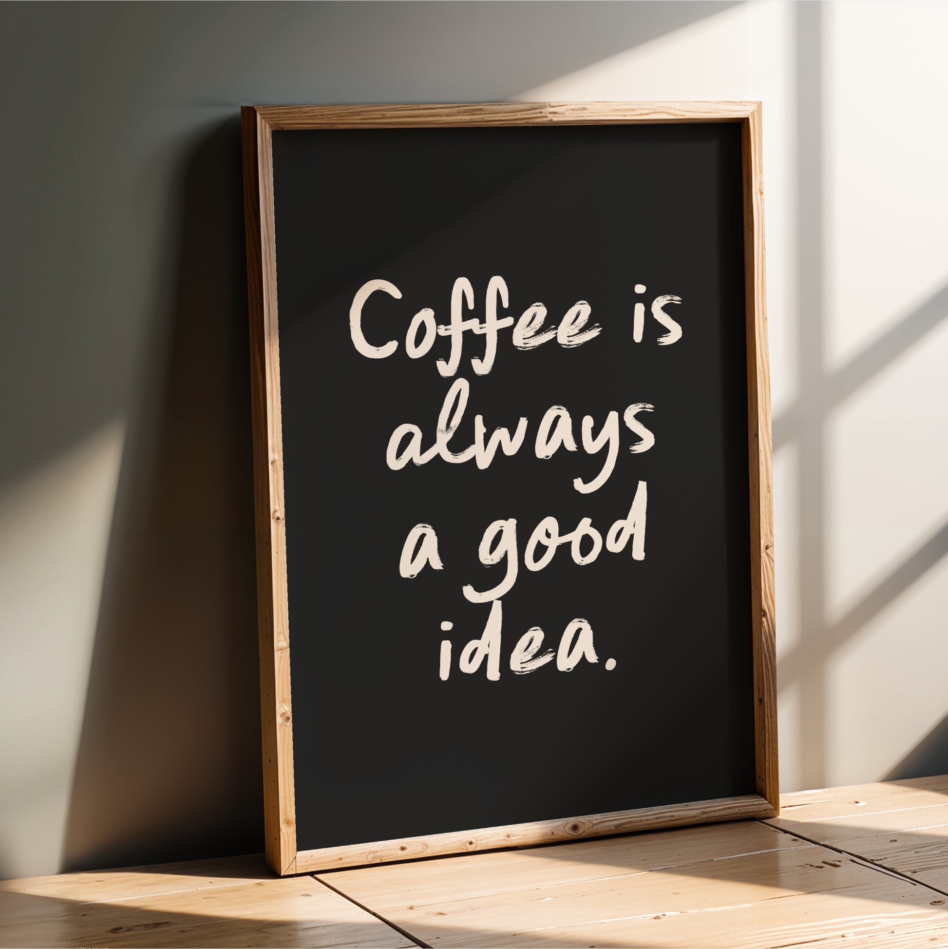 A blackboard with the text "Coffee is always a good idea" written on it in white chalk.