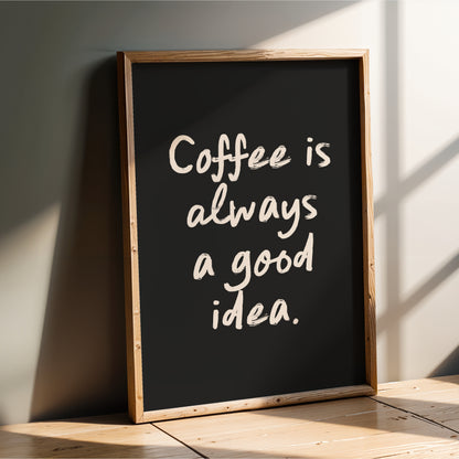 A blackboard with the text "Coffee is always a good idea" written on it in white chalk.