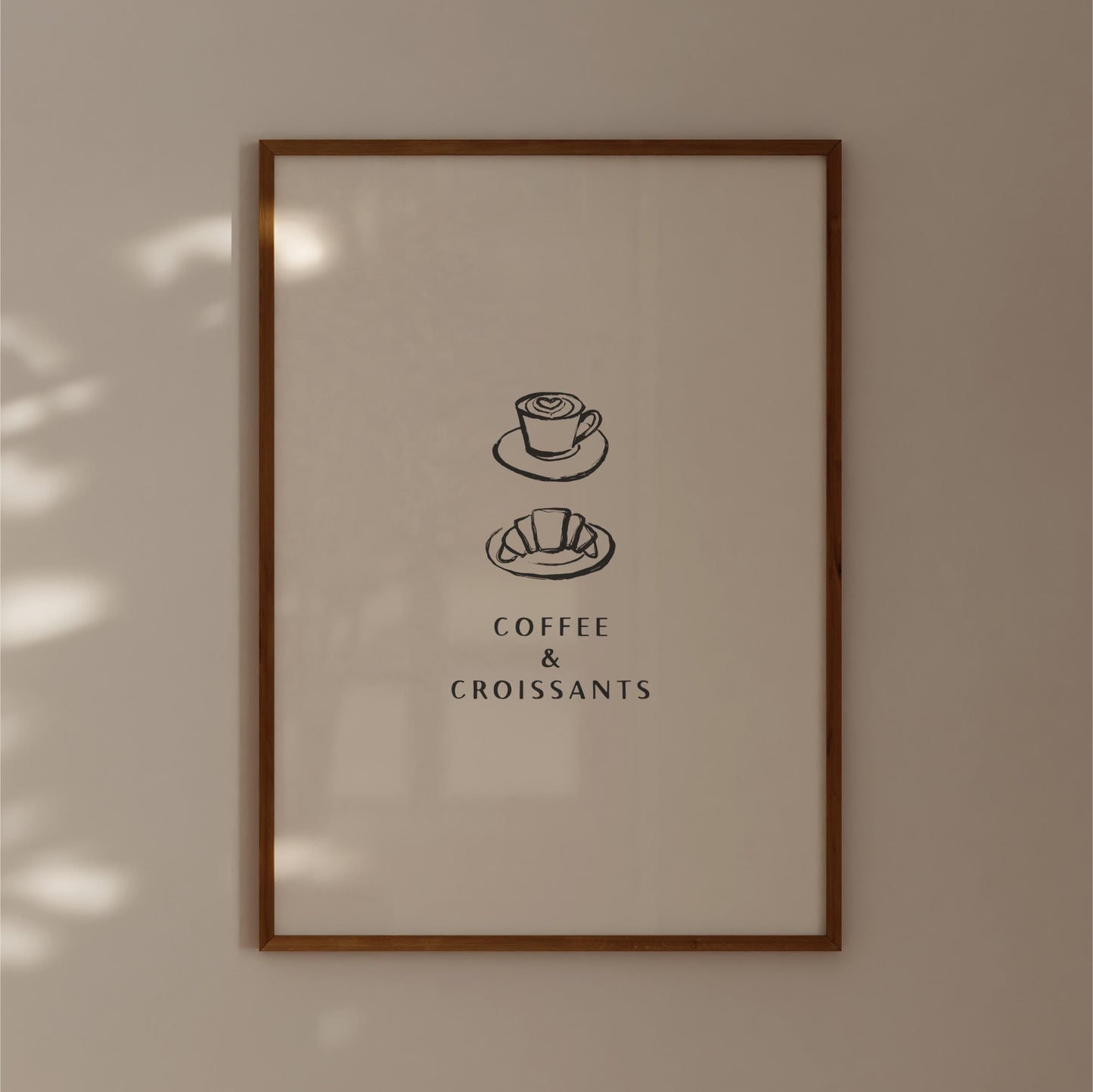 The image is a framed poster with a simple design featuring a cup of coffee and a croissant, accompanied by the text "COFFEE & CROISSANTS".