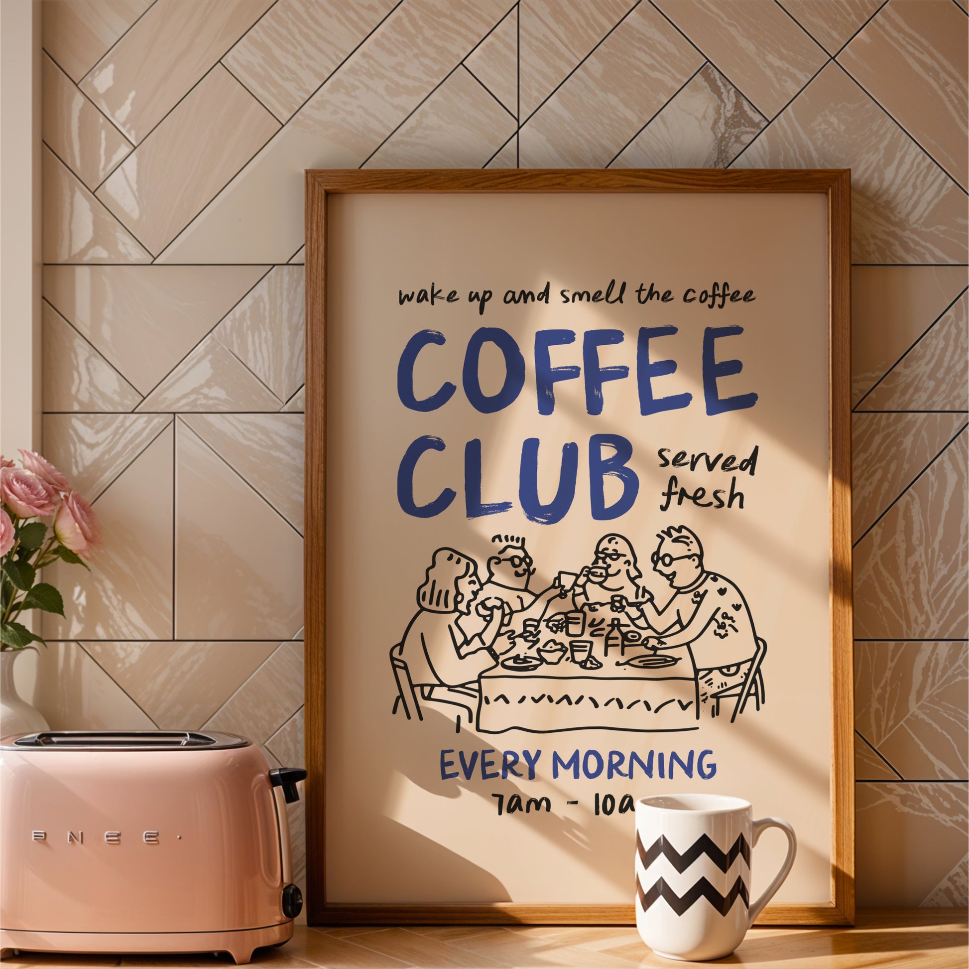 a framed poster advertising a coffee club, with a toaster and a coffee mug placed next to it on a countertop.