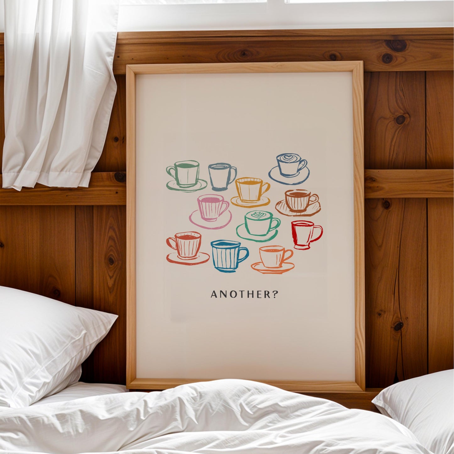 a framed poster with a colorful illustration of various coffee cups and saucers, along with the text "Another?"