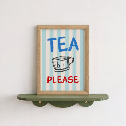 A framed sign with the text "TEA PLEASE" and an illustration of a cup, mounted on a shelf against a white wall.