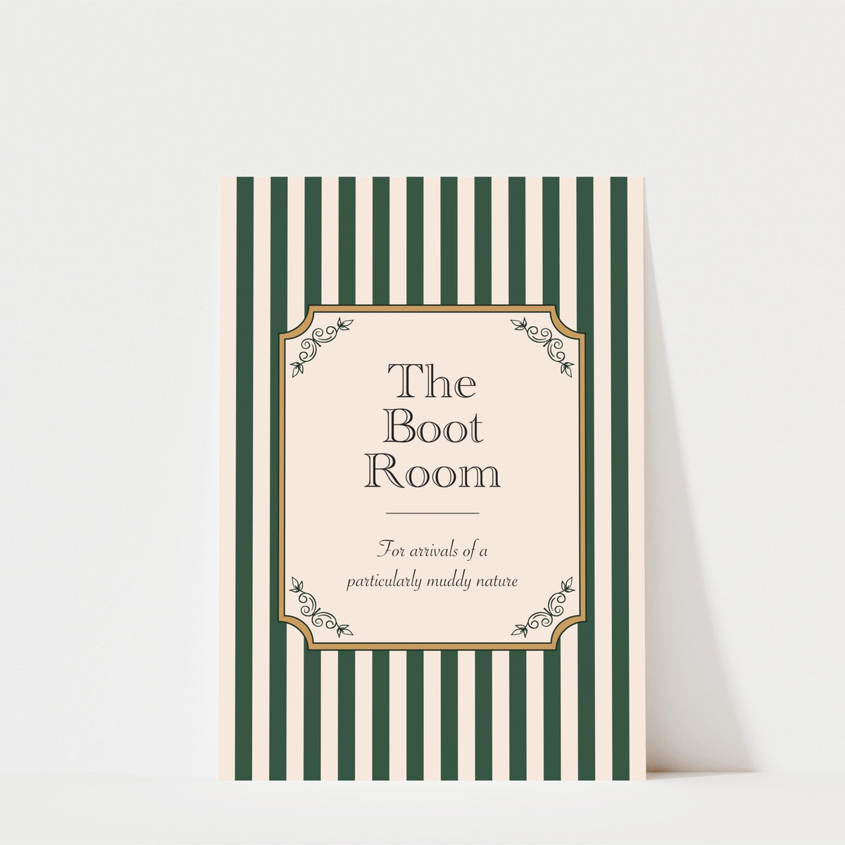 The image is a poster or sign with a striped background and a decorative border. The text on the poster reads "The Boot Room" and "For arrivals of a particularly muddy nature".
