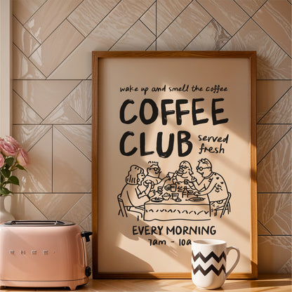 a framed poster advertising a coffee club, with a toaster and a coffee mug placed next to it on a countertop.