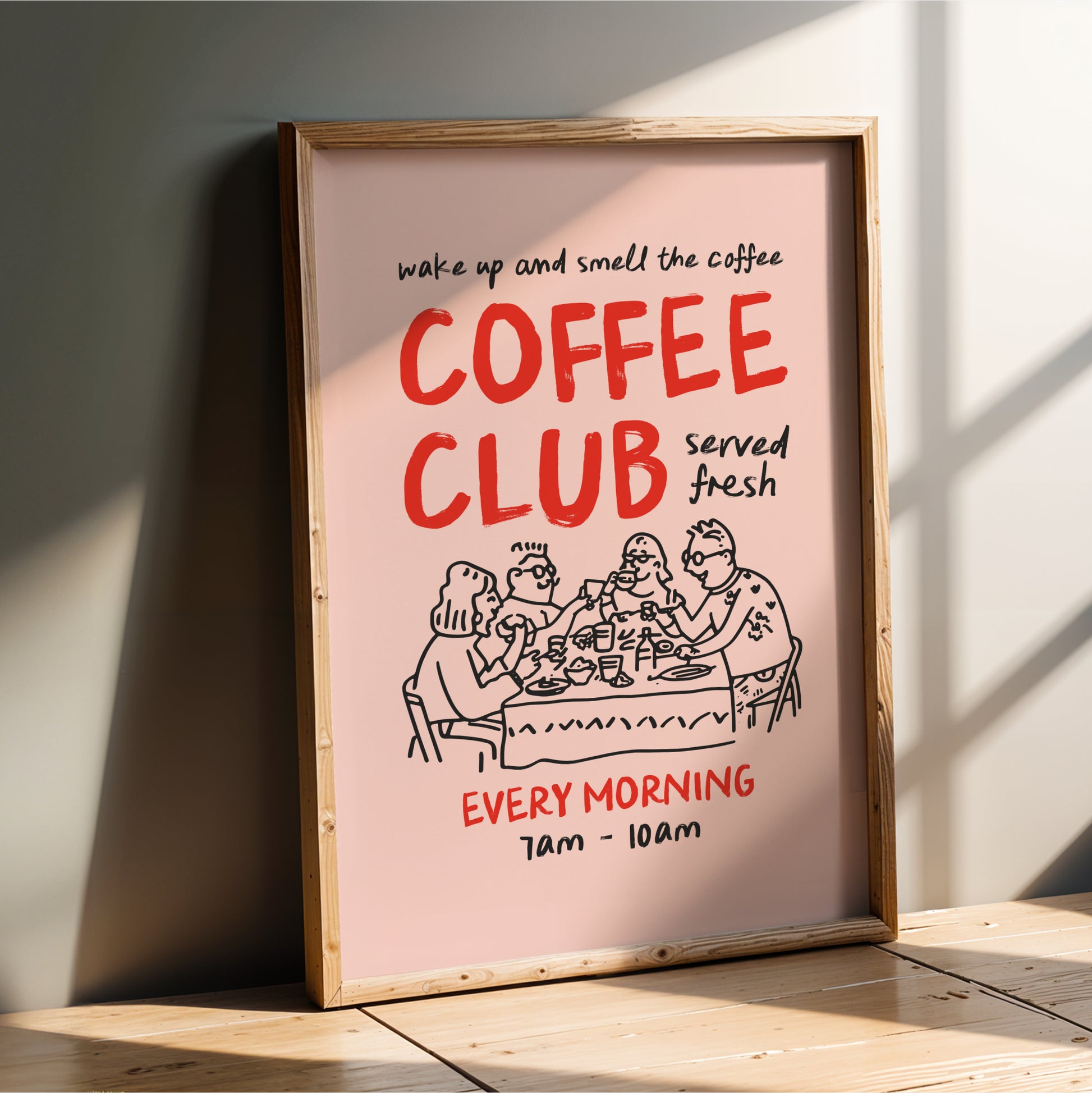 The image is a framed poster advertising a coffee club. It features a cartoon illustration of people sitting at a table, with text that reads "wake up and smell the coffee" and "coffee club served fresh every morning".