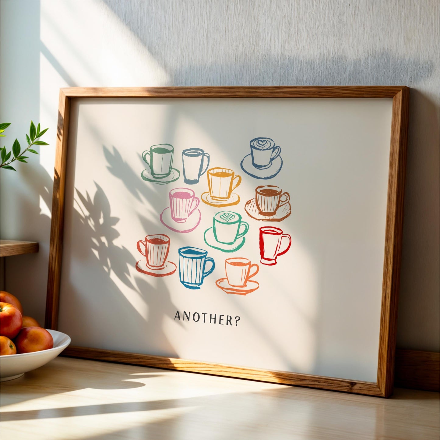 a framed artwork with a central illustration of various coffee cups and saucers, accompanied by the text "Another?"