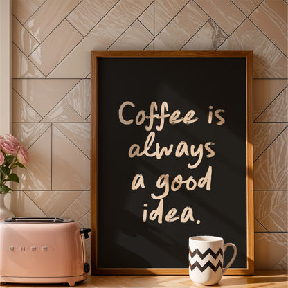 a framed sign with the text "Coffee is always a good idea" and a pink toaster on a kitchen counter.