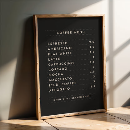 a black coffee menu board with white text, placed on a wooden surface.
