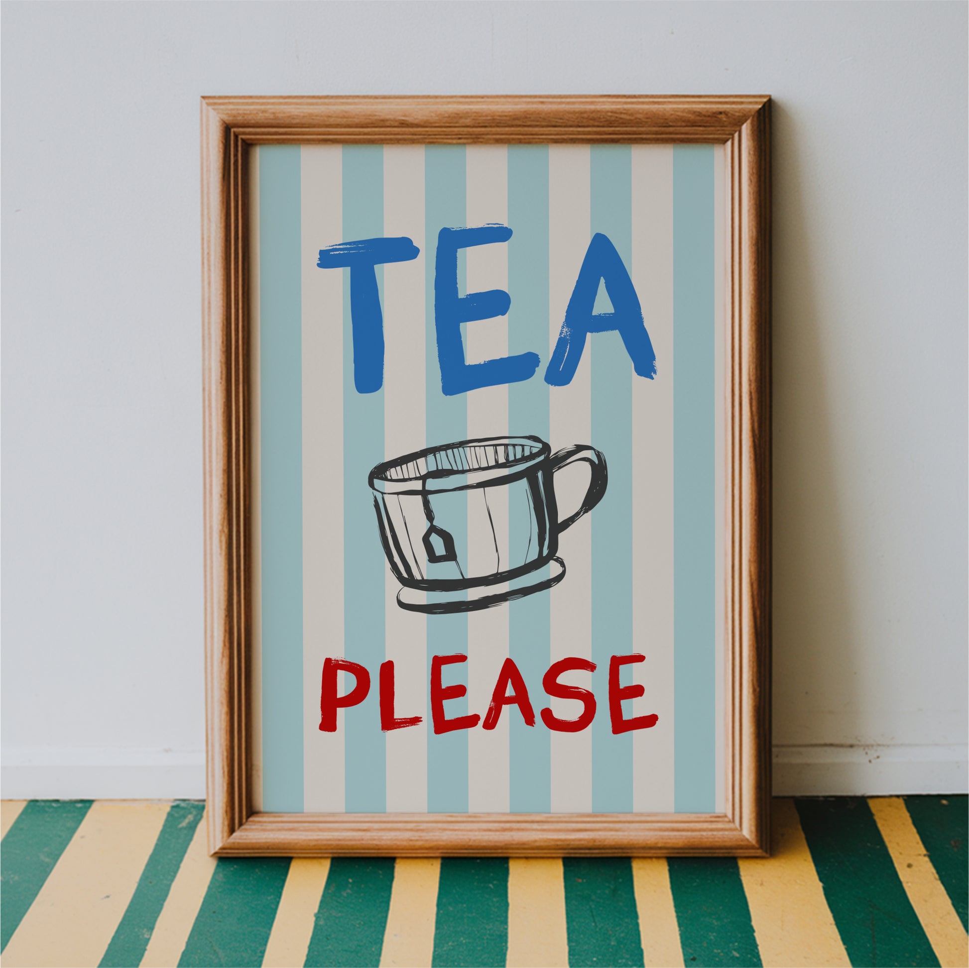 A framed poster with the text "TEA PLEASE" and an illustration of a cup or mug.