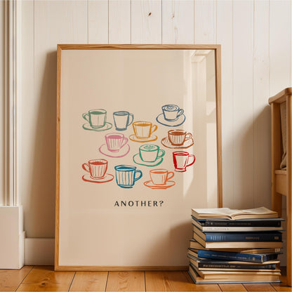 A framed poster with a colorful illustration of various coffee cups and saucers, accompanied by the text "ANOTHER?"
