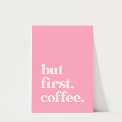A pink poster with the text "but first, coffee."