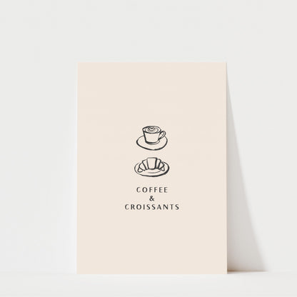 a simple illustration of a coffee cup and croissant on a light-colored background, accompanied by the text "COFFEE & CROISANTS".
