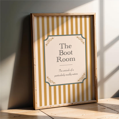 a framed sign with a striped pattern and decorative elements, placed on a wooden surface against a white wall.
