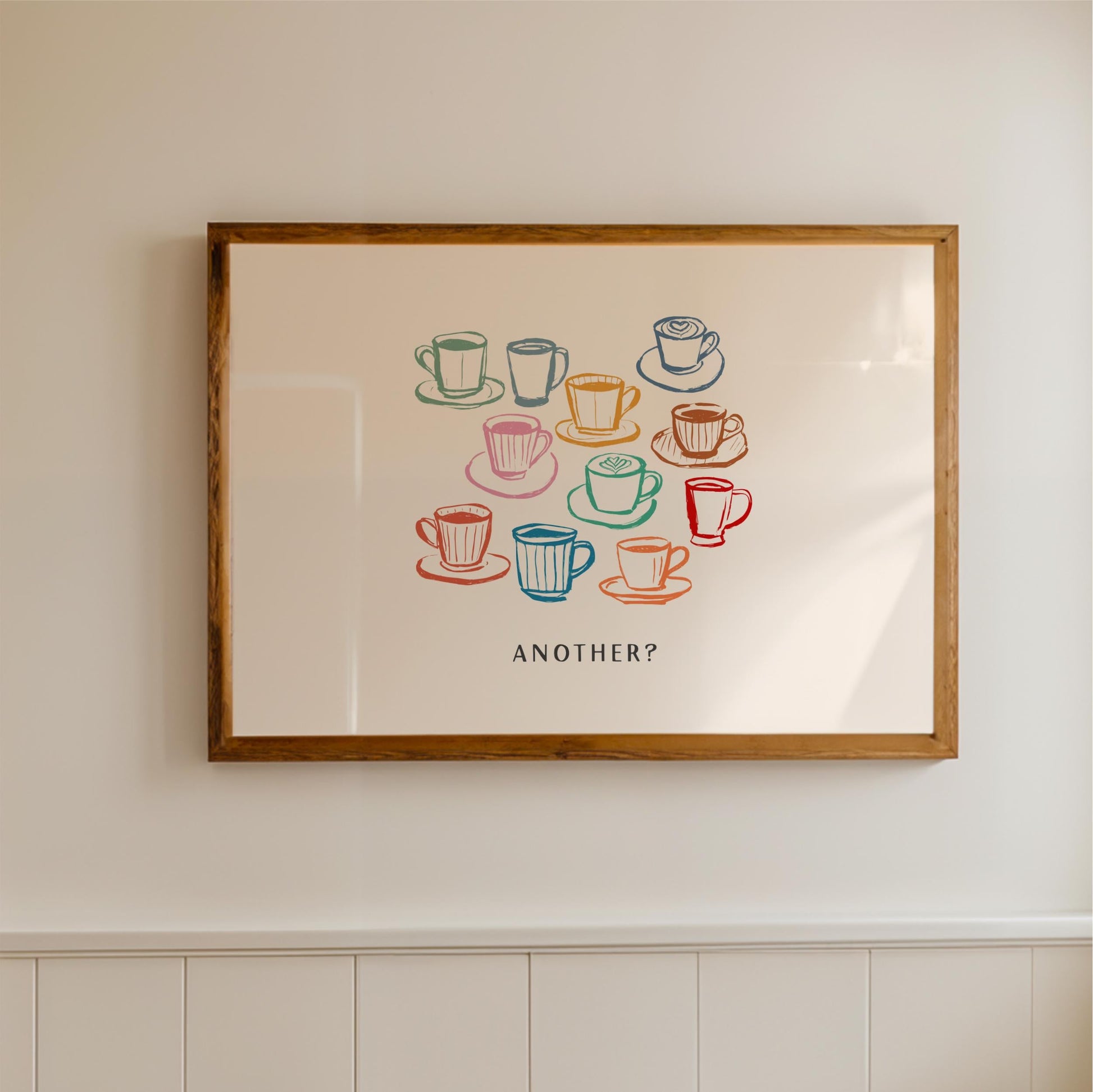 a framed artwork with a central illustration of various coffee cups and saucers, accompanied by the text "Another?"