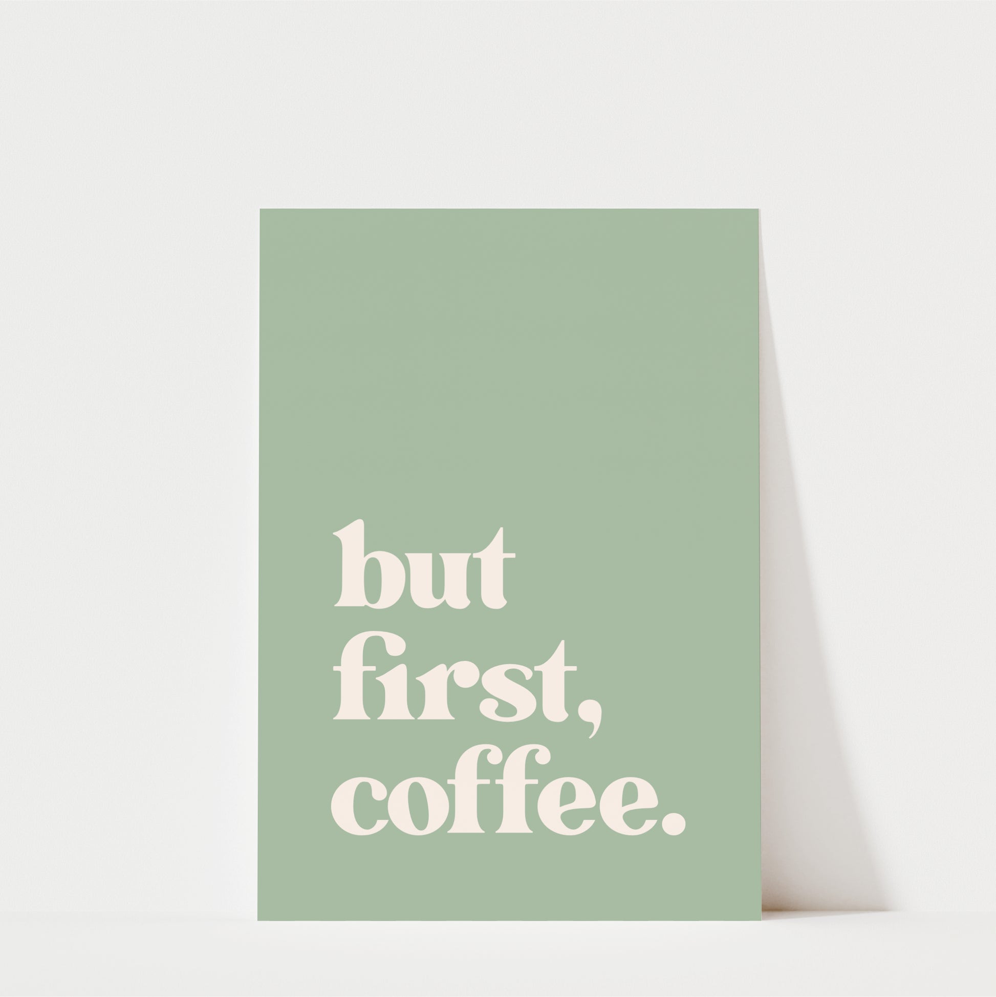 A simple green poster with the text "but first, coffee."