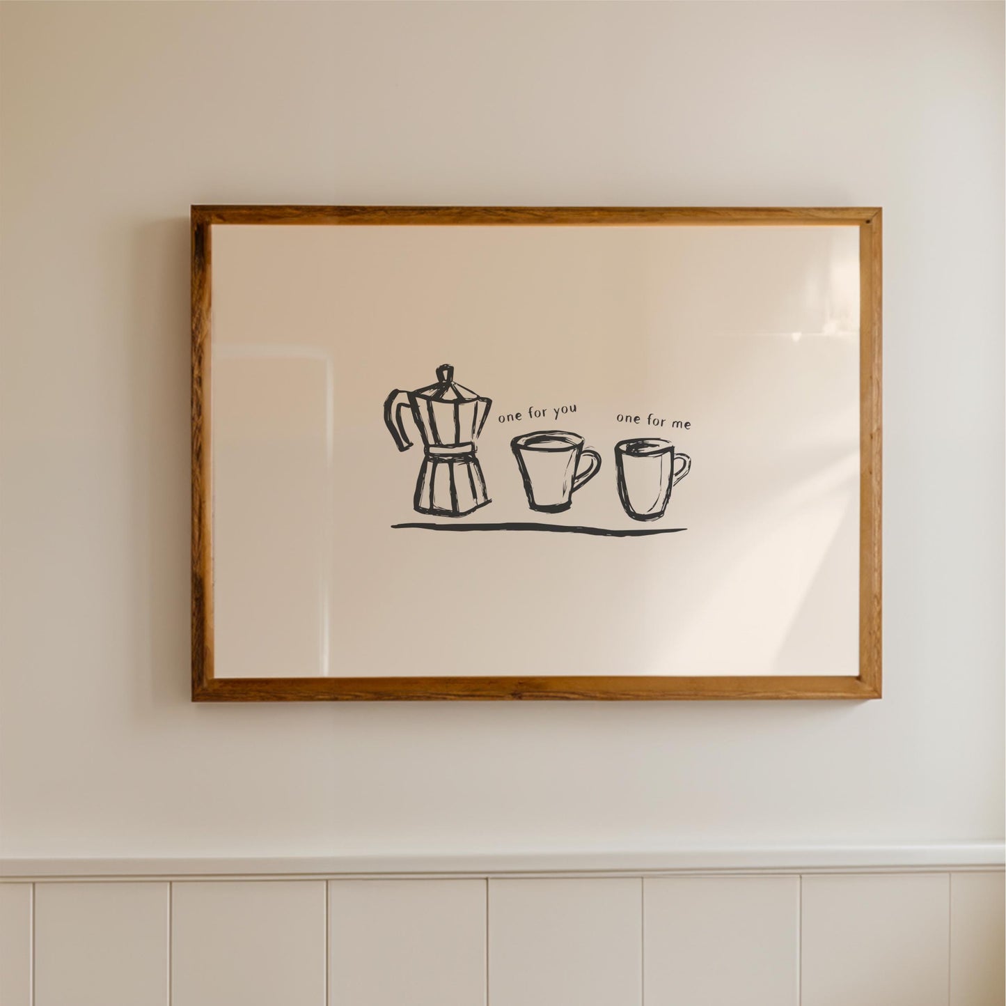 a framed artwork hanging on a wall, depicting a coffee maker and two cups.