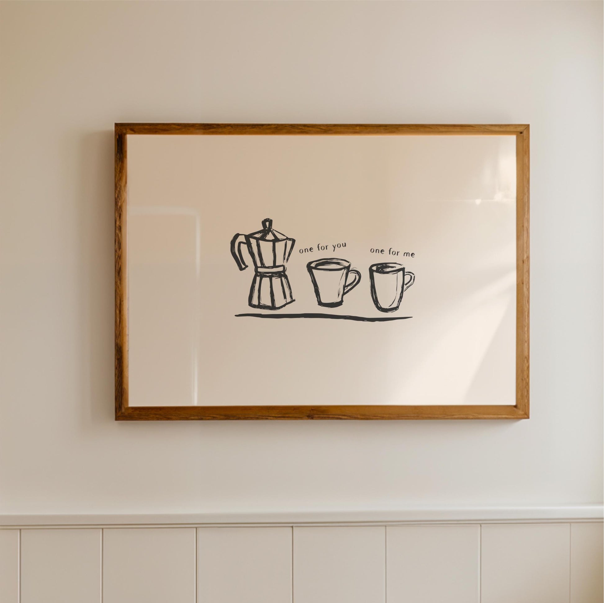 a framed artwork hanging on a wall, depicting a coffee maker and two cups.