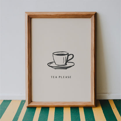 A framed print with a simple black and white illustration of a cup of tea on a saucer, accompanied by the text "TEA PLEASE" in a bold, capitalized font.