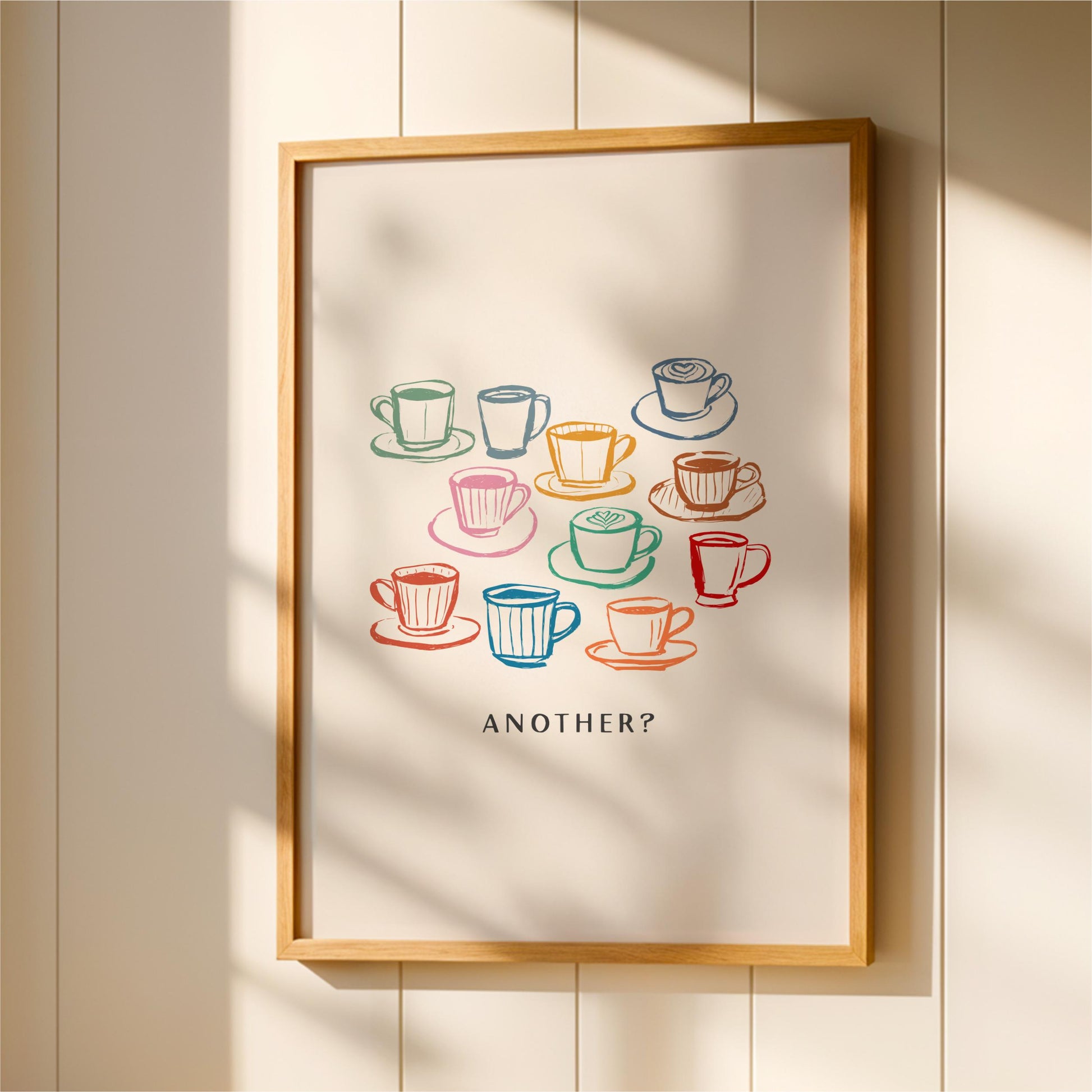 a framed poster with a creative design of colorful coffee cups and saucers arranged in a grid pattern.