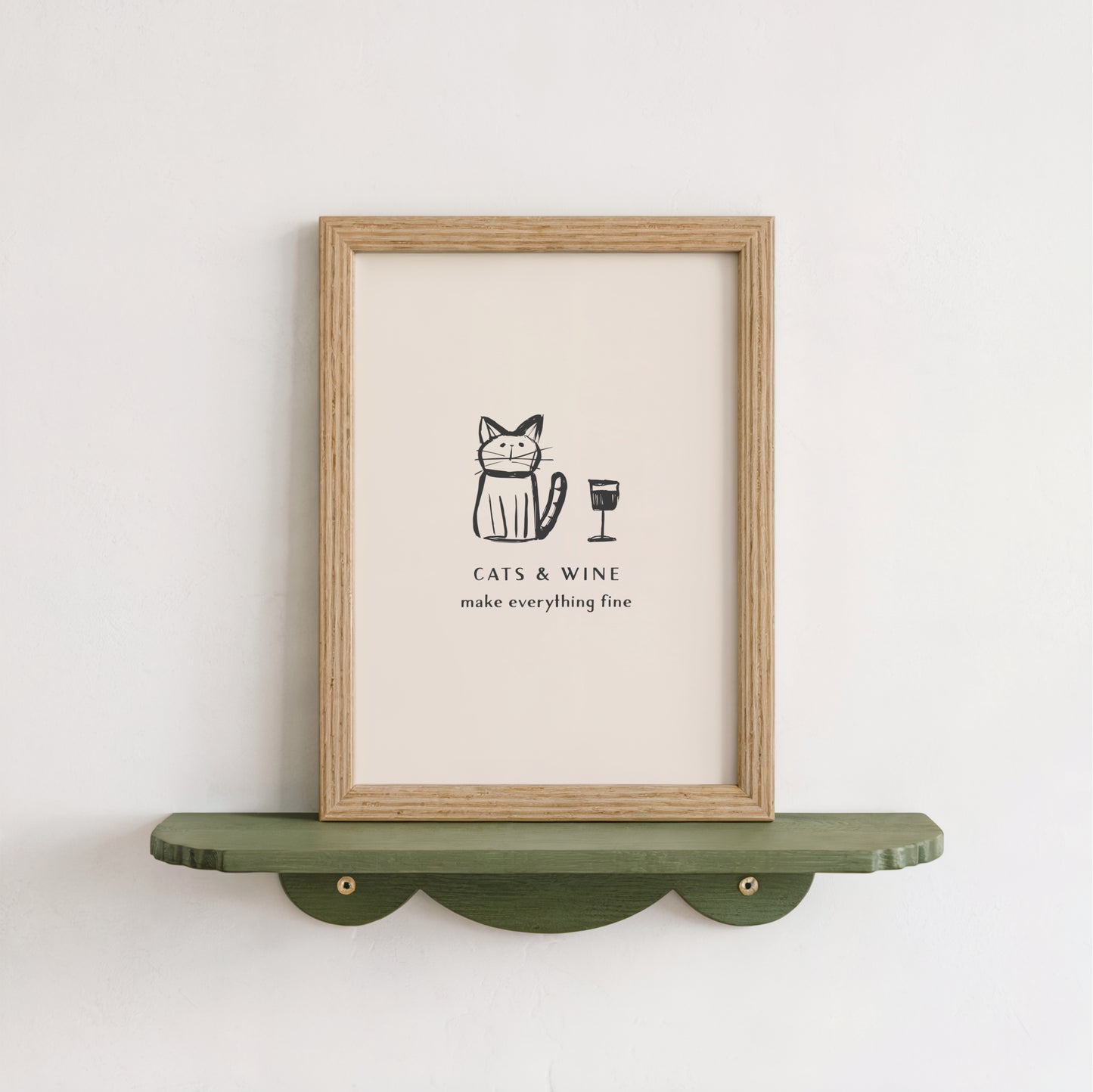 a framed poster with a cat and a wine glass, accompanied by the text "CATS & WINE make everything fine".